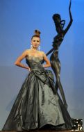 The model demonstrates outfit