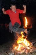 Boy jumps through a fire