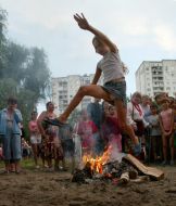 Girl jumps through a fire