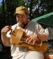 A musician plays on hurdy gurdy