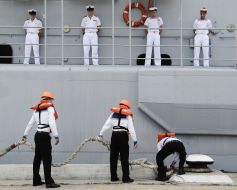 The sailors moored to the pier frigate ”Jean de Vienne”