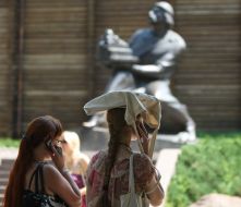 Girl carries her bag on a head