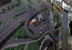 A worker demonstrates a model