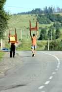 Young people carry tables