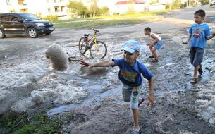 Children play with a hail