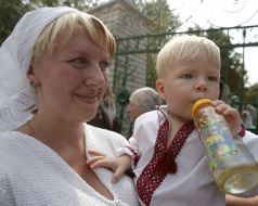 A woman holds a child