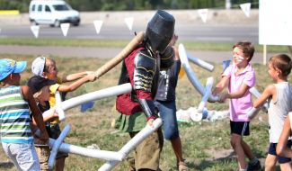 Children battle with a knight