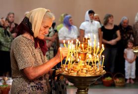Woman puts the candle