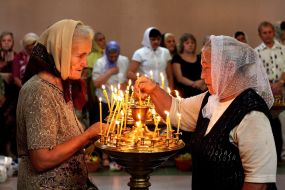 Womans puts the candle