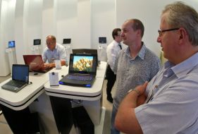 Visitors examine notebooks