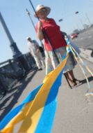 The participant of action opens out a ribbon