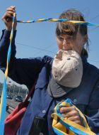 The participant of action opens out a ribbon