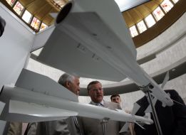 Anatoly Gritsenko inspects exhibits