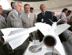 Anatoly Gritsenko inspects exhibits