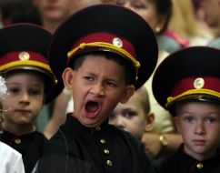 A first-class boy yawns