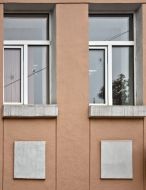 Bullet holes in the windows of the office