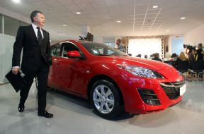 Yury Gorbunov near the car Mazda 3