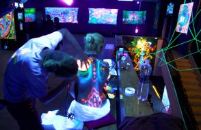 An artist paints a model