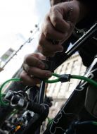 A man ties a bicycle to the tree