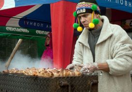 A salesman grills a shashlick