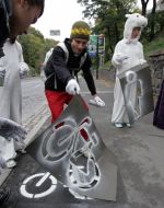 A bicyclist holds the sign of bicycle path