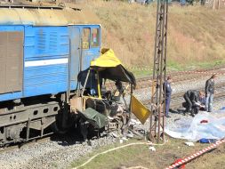 Clash of bus and locomotive