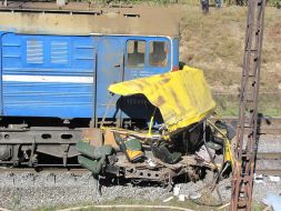 Clash of bus and locomotive