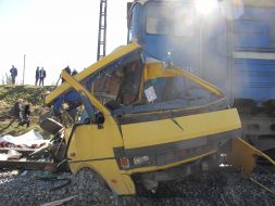 Clash of bus and locomotive