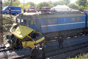 Clash of bus and locomotive