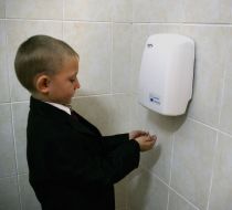 Boy dries hands