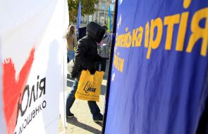 Elderly man near agitations tents