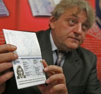 Aleksandr Dranikov demonstrates Biometric Passport