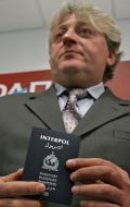 Aleksandr Dranikov demonstrates the passport officer INTERPOL