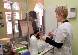 The pharmacist sells drugs