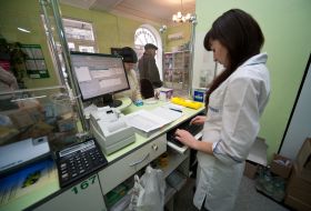 The pharmacist sells drugs