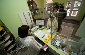 The pharmacist sells drugs