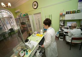 The pharmacist sells drugs