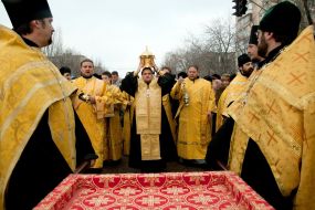 Bishop Joseph holds the shrine with the relics