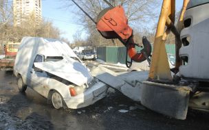 Concrete box unitslie on the hood of car