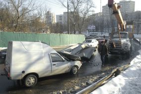 Concrete box unitslie on the hood of car