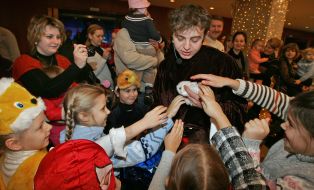 Children examine a rabbit