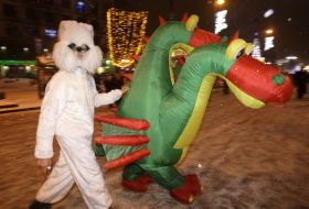 Young people in the suits of Slavic dragon and rabbit