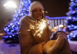 A girl holds ”bengal-light”