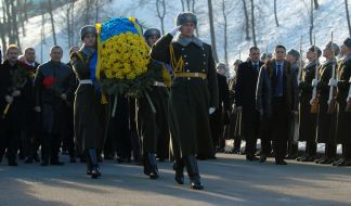 Ceremony of laying-on of flowers to the memorable sign to Heroes Kruty