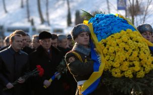 Ceremony of laying-on of flowers to the memorable sign to Heroes Kruty