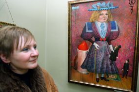 A visitor examines a picture
