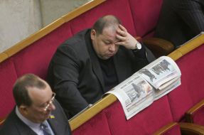 People's deputy reads the newspaper