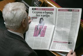 People's deputy reads the newspaper