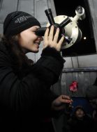 The Girl looks through a telescope on the Moon