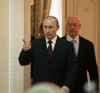 Vladimir Putin and Nikolay Azarov